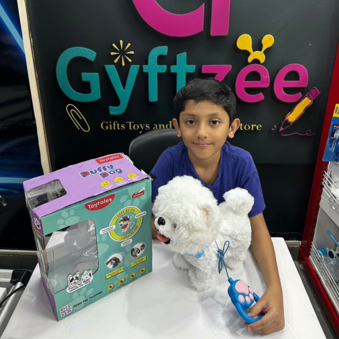 A child sitting in front of a 'Gyftztee' counter with a remote-controlled plush dog toy in their lap, with the toy's packaging visible beside them.