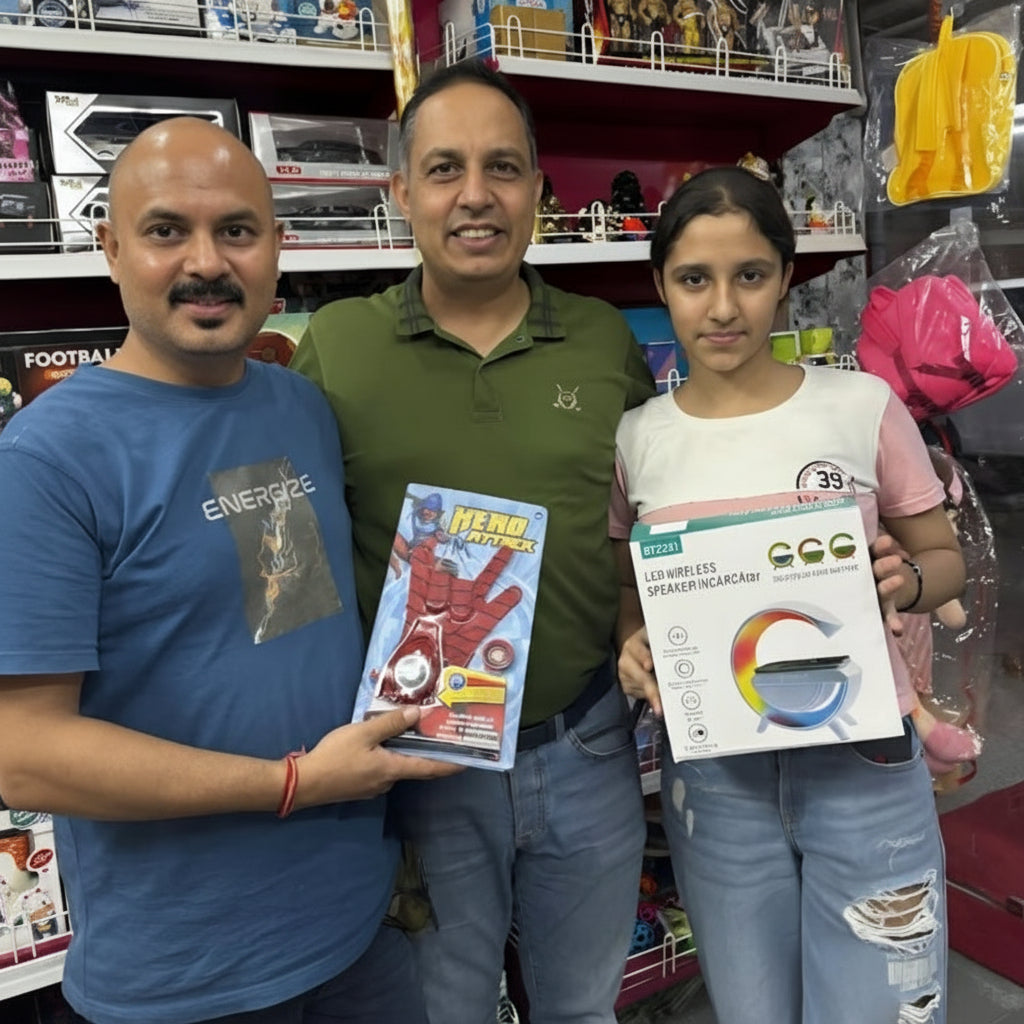Three people holding electronic products in a store with Gyftzee branding.