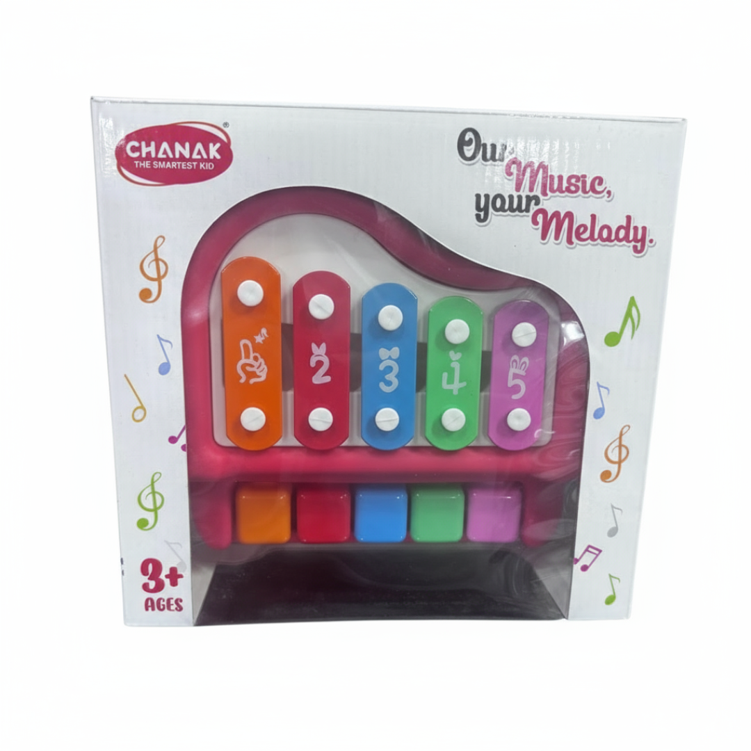 Toy piano with colorful keys in packaging, brand 'Chanak' visible