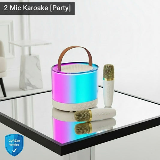 Two microphones with a colorful bucket on a glass table, branded 'GyftZee'.