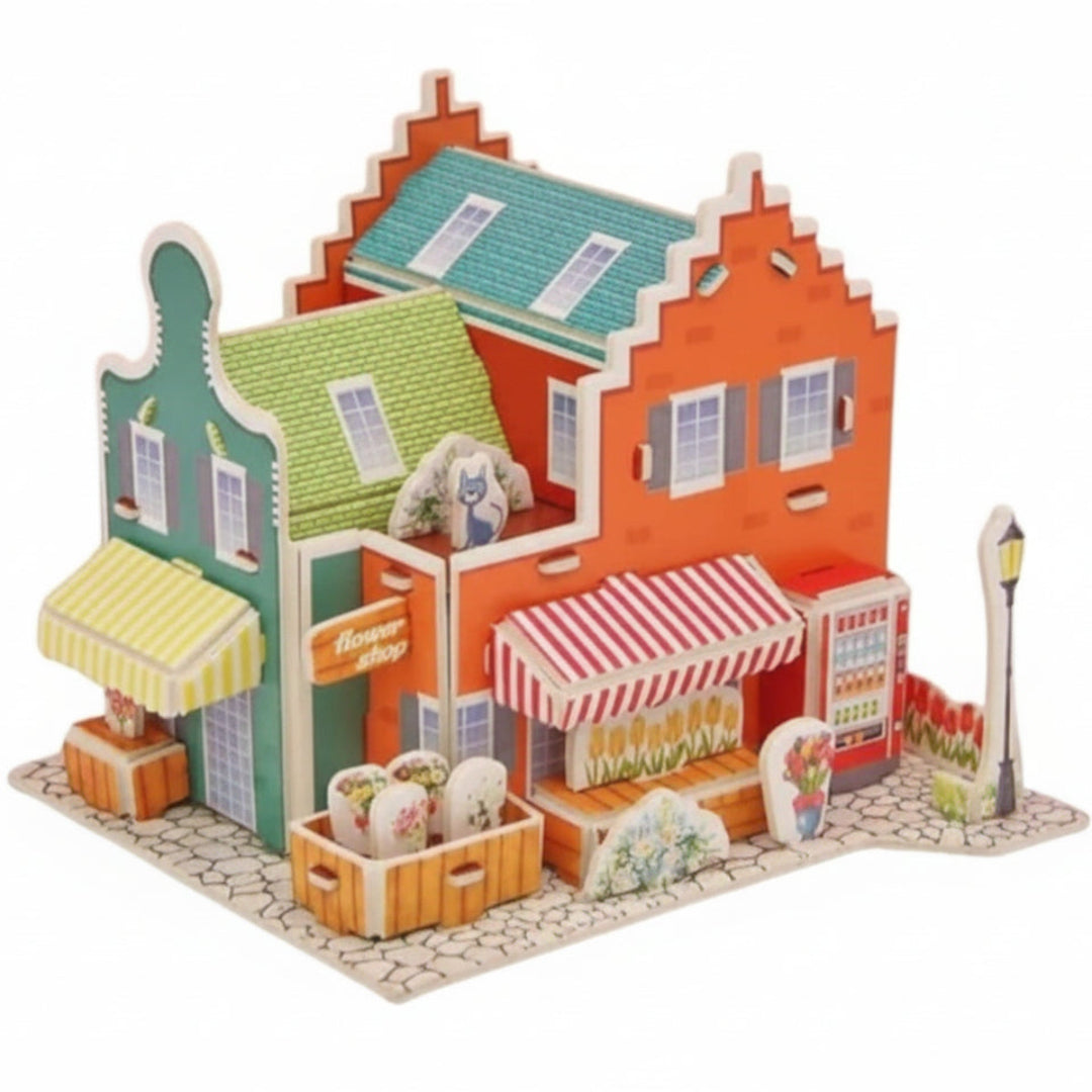 Colorful model of a town with buildings and street elements on a white background