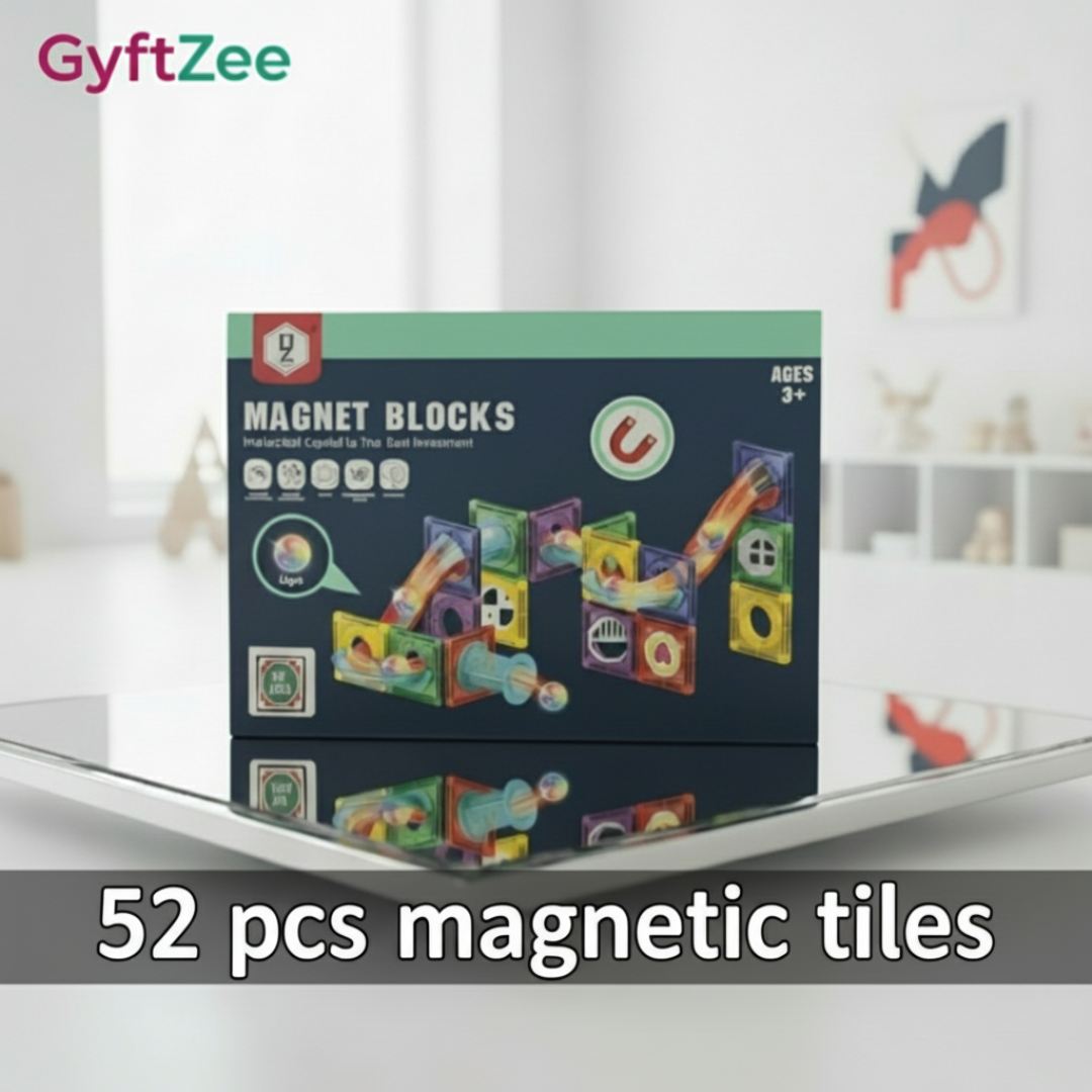 Box of GyftZee magnet blocks on a white surface with a blurred background