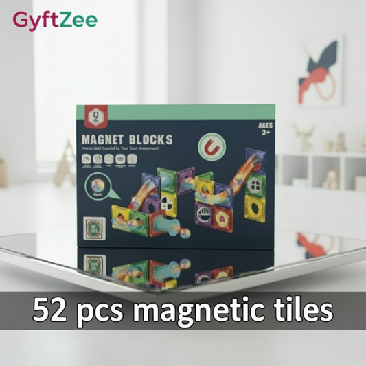 Box of GyftZee magnet blocks on a white surface with a blurred background