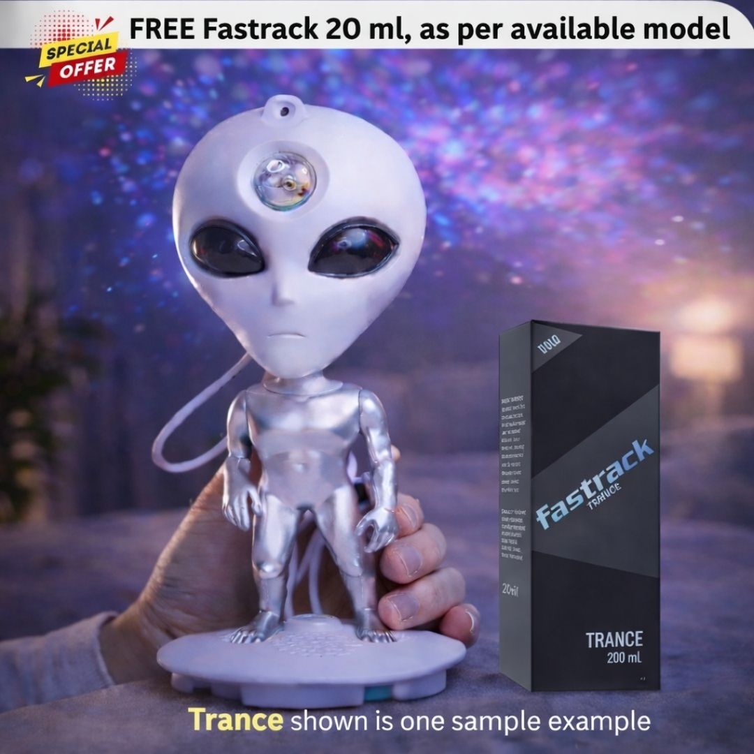 Alien figurine held by a hand with a Fastrack Trance product box in the background