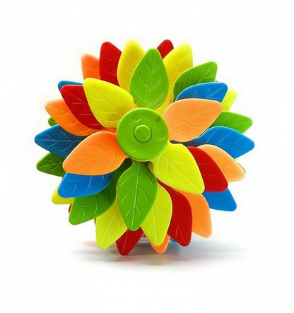 Colorful flower-shaped toy held by a hand on a white background