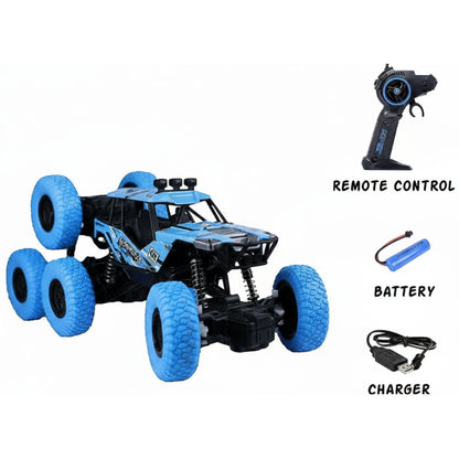 Blue remote control monster truck with remote control, battery, and charger on a white background
