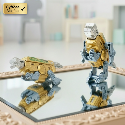 Gold and silver robot model on a reflective surface with a blurred background