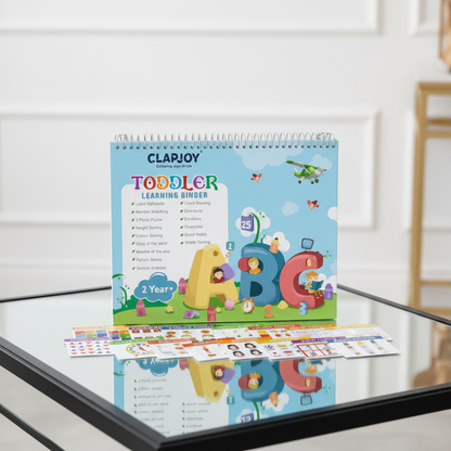 CLARJOY toddler learning binder on a glass surface with a white wall background
