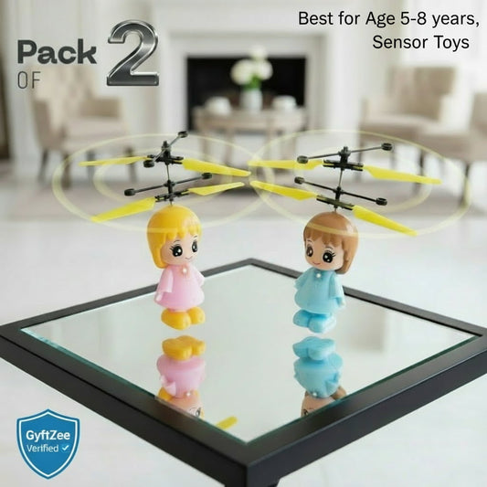 Two toy figures with yellow propellers on a reflective surface in a room setting. Sensor Flying Toys best kids age 5-8 years