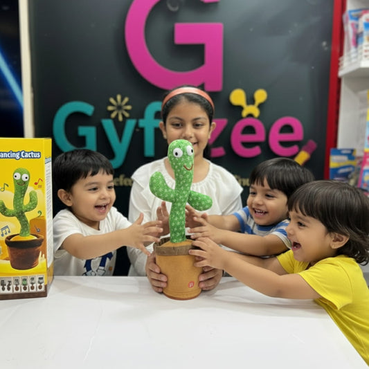 Children playing with a toy cactus in front of a Gyf zee sign.