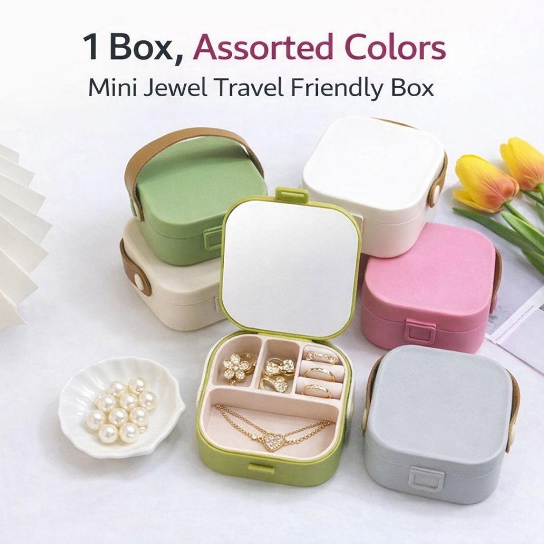 Assorted colors mini jewel travel friendly box with jewelry on a white background