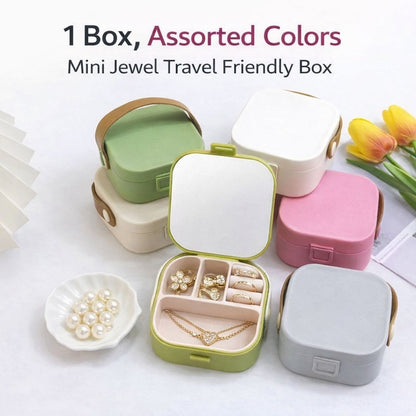 Assorted colors mini jewel travel friendly box with jewelry on a white background