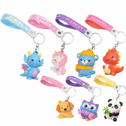 Set of colorful keychains with animal figures on a white background