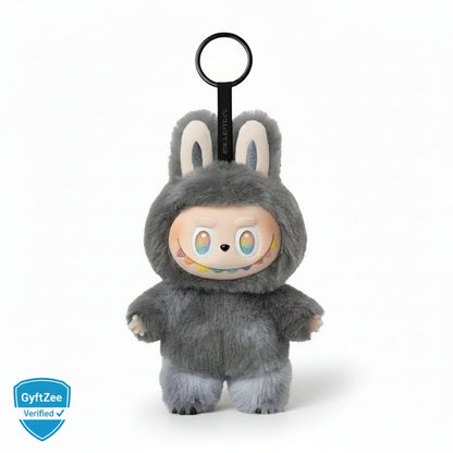 Plush toy with a keychain attachment on a white background, featuring the GyftZee logo. . Famous trending Labubu Doll