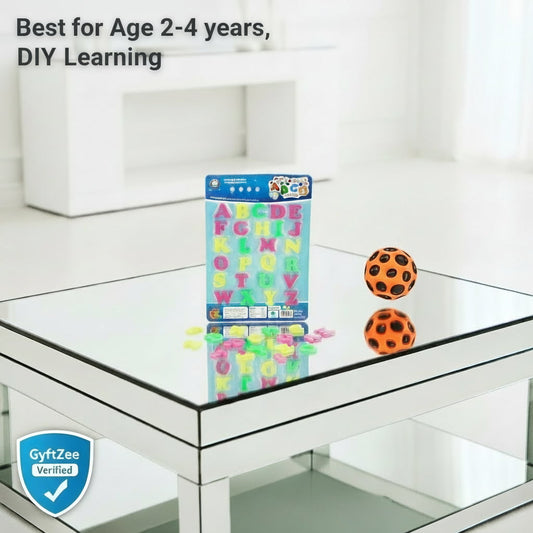 Educational toy set with letters and numbers on a glass table, suitable for ages 2-4.