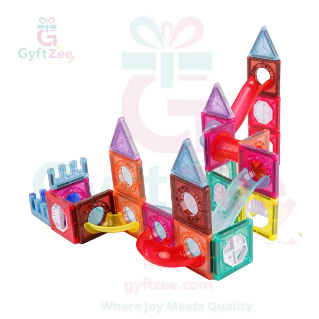 Colorful magnetic building blocks set on a white background with 'GyftZee' branding.