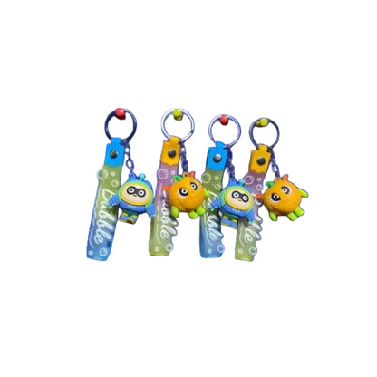 A collection of colorful pumpkin-shaped keychains in various colors attached to keys.