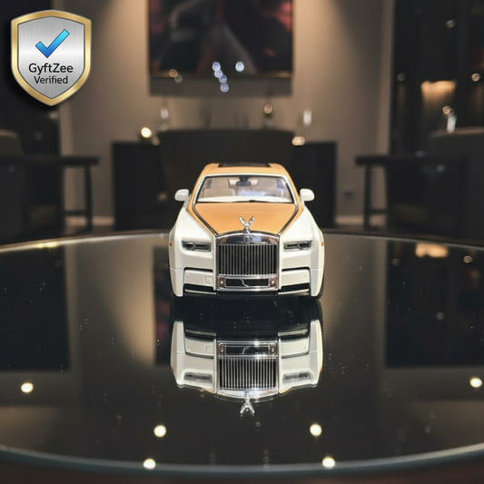 Model of a luxury car on a reflective surface with a blurred indoor background