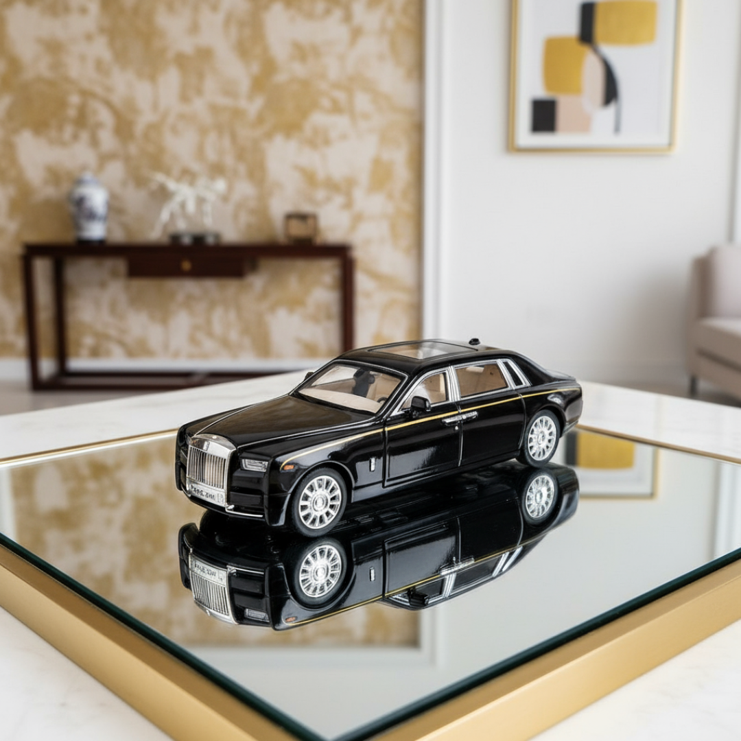 Black model car on a reflective surface with a decorative background