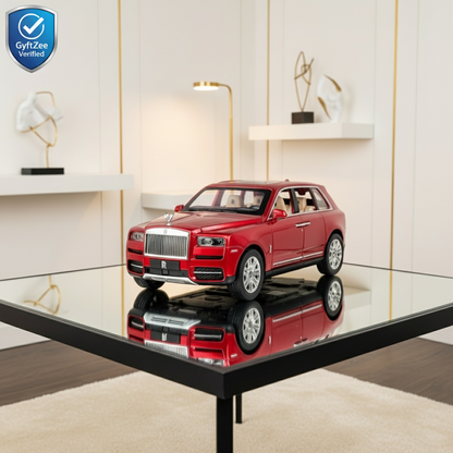 Red toy car on a reflective surface with a modern interior background