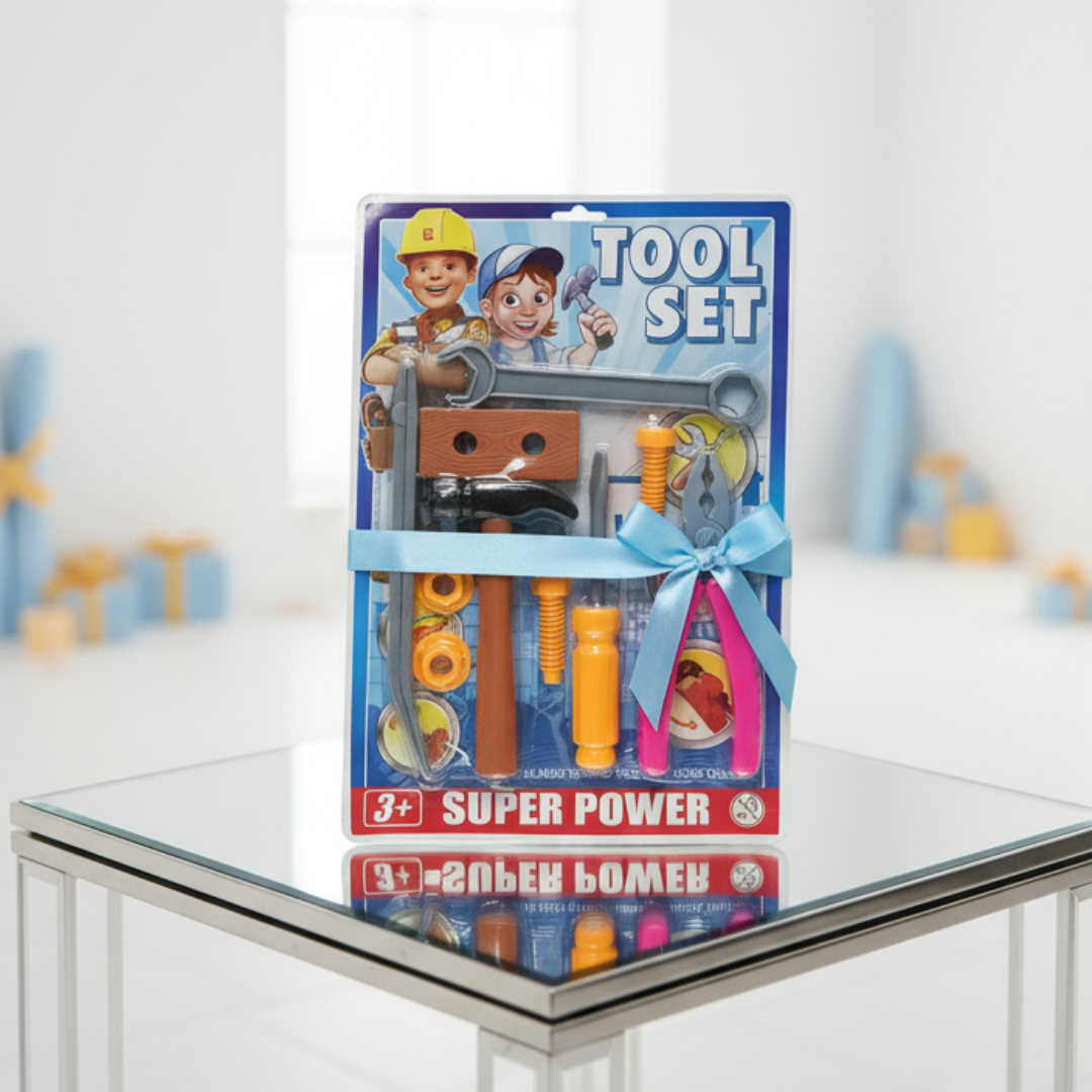 Toy tool set packaging on a glass table with a blurred background
