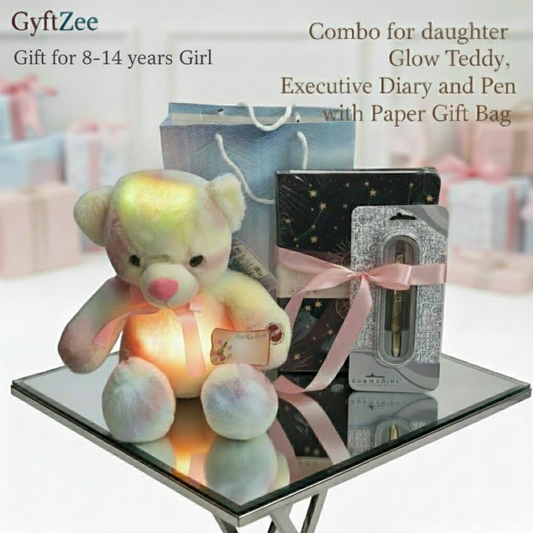 Glowing teddy bear with a pen set and gift bag on a reflective surface, with 'GyftZee' branding.