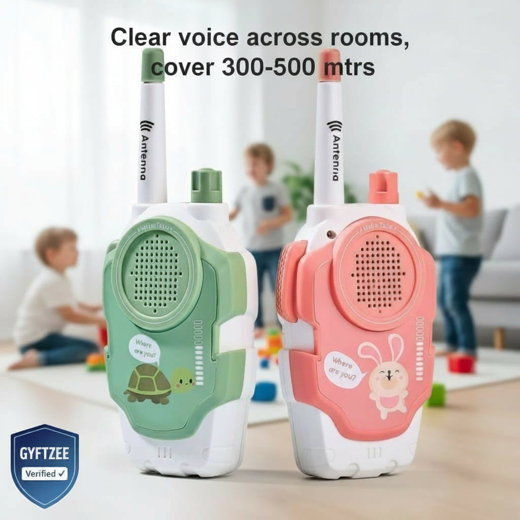 Two walkie-talkies, one green and one pink, with children playing in the background.
