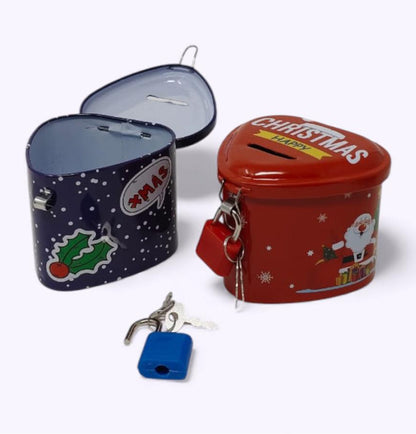 Two tin containers, one blue with festive design and one red with Christmas text, on a white background.