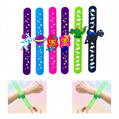 Set of colorful slap bracelets with space and dinosaur designs, displayed against a blue sky background.