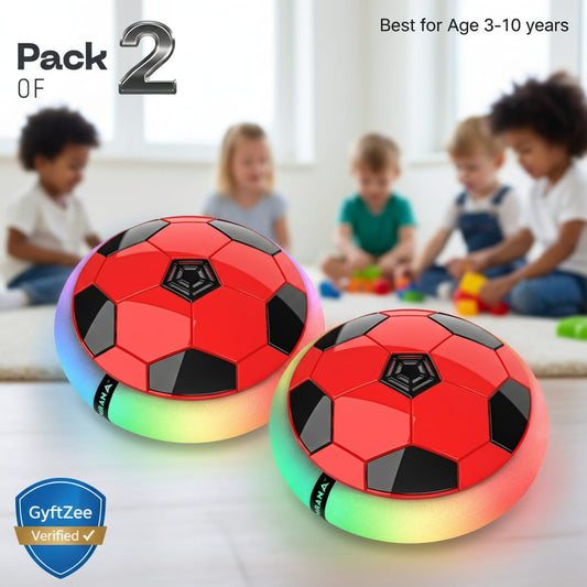 Two red and black soccer ball toys with colorful bases on a light background, surrounded by children playing. Hover football